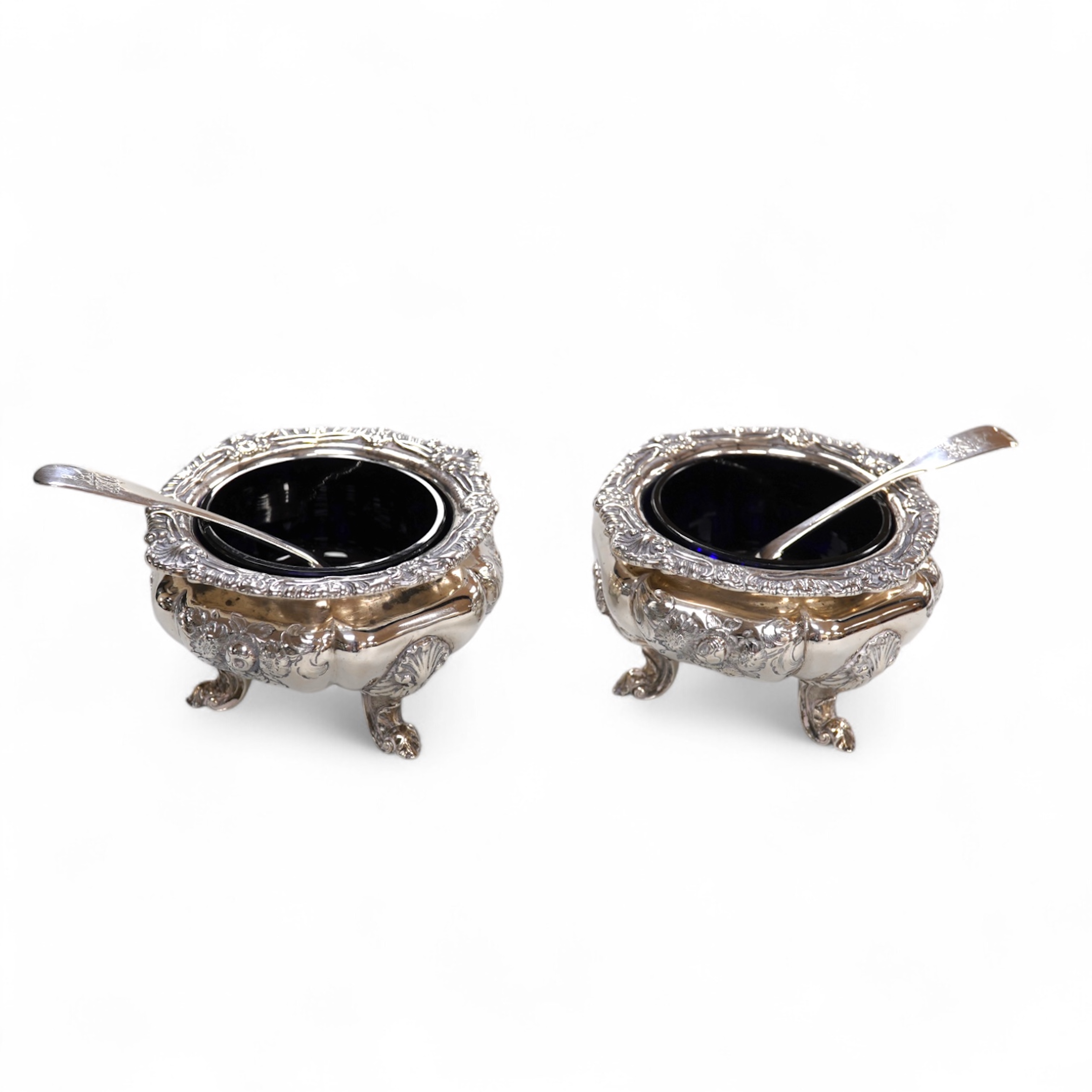 A pair of early Victorian silver cauldron salts, by John Tapley, London, 1838, with later blue glass liners, diameter 94mm, together with a pair of George IV silver Old English pattern condiment spoons, London, 1828.